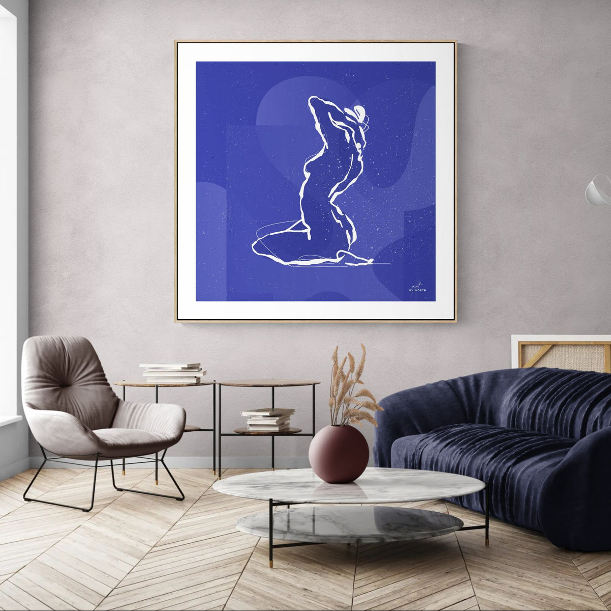 minimalist wall art with line figure displayed in modern living room with calm blue tones