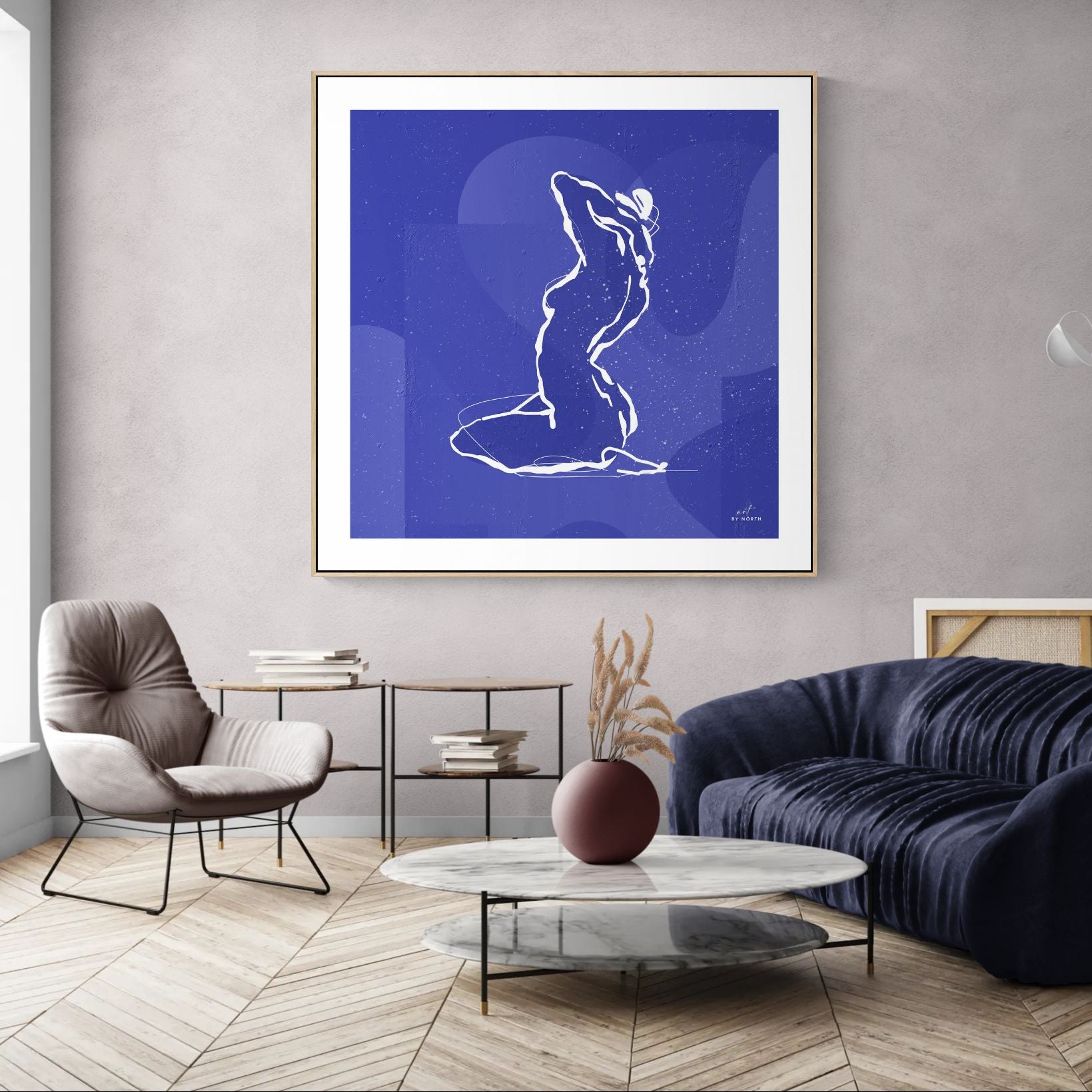 minimalist wall art with line figure displayed in modern living room with calm blue tones