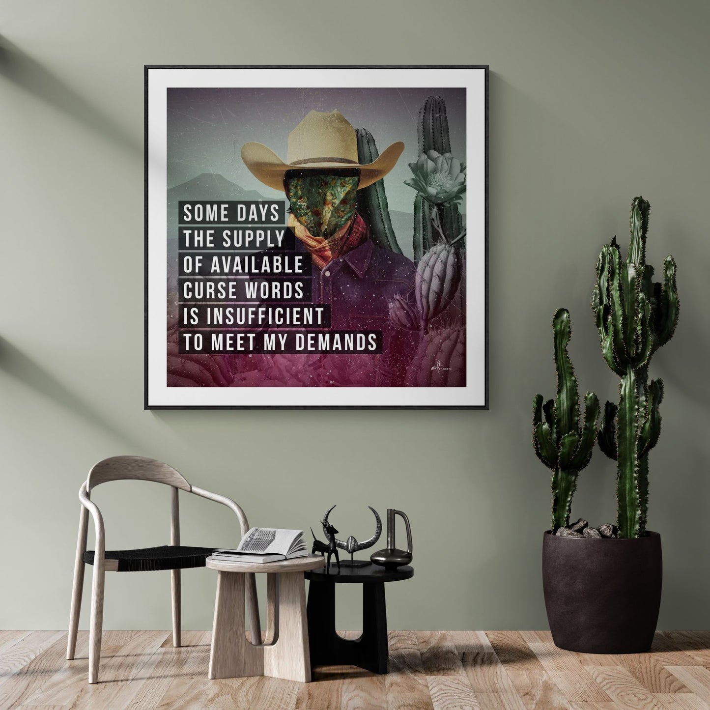 modern wall art with figurative portrait and text statement in contemporary lounge area