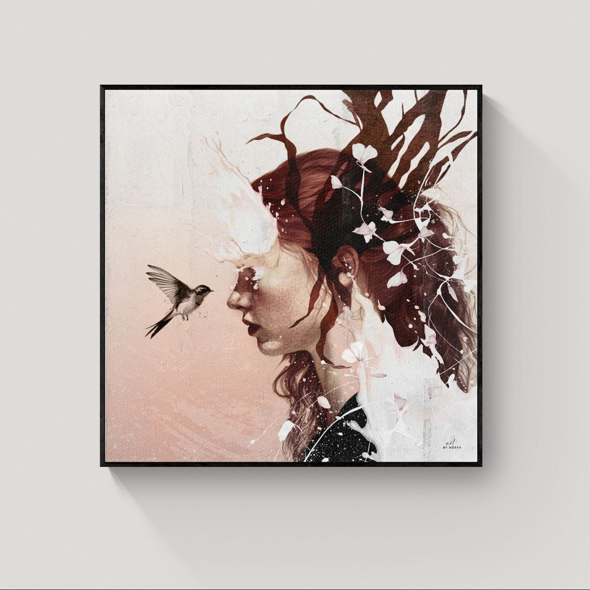 modern surreal wall art with black frame adding contrast to soft composition