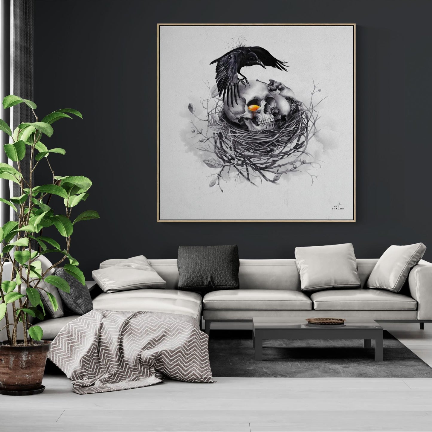 surreal skull canvas wall art with crow and glowing orange detail in modern living room with stylish interior